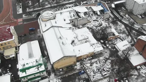 The destroyed building of the theater by a rocket during the Russian invasion of Stock-Footage 222948346