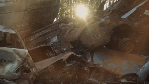 Destroyed cars after the Russian attack in Bucha in sun light  Stock Footage 253224030