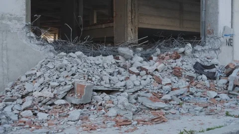 Destroyed concrete wall, Bricks and Crumbling View, Devastation shot Stock Footage 258097757