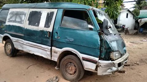 Destroyed crashed green van accident Stock Photos