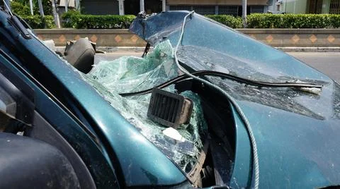 Destroyed damaged car front window broken glass Stock Photos