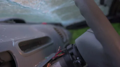 The destroyed dashboard and cracked windshields of a car after an accident. Stock Footage 235913155