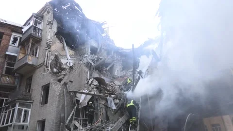 Destroyed due to the hit of a Russian missile residential building. Firefighters Stock-Footage 215074331