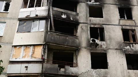 Destroyed during the shelling and black from the fire house in the Ukrainian Stock Footage 217781335