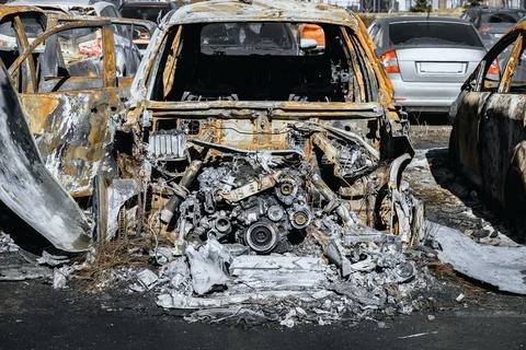 Destroyed engine and under the hood space of burned car. Stock Photos