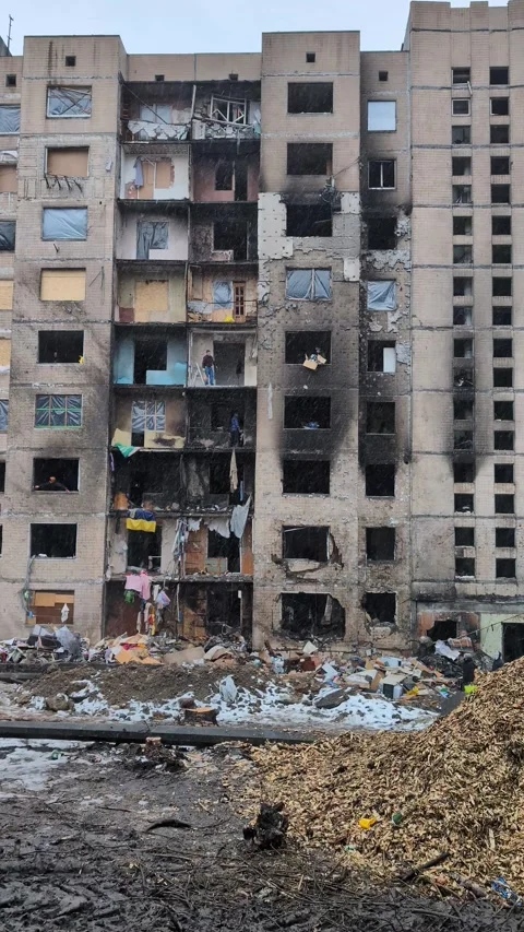 The destroyed facade of a house damaged as a result of a massive missile st.. Stock-Footage 260501261