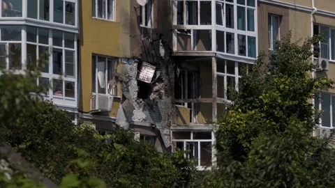 The destroyed facade of a residential building. Consequences of military actions Stock Footage 243775981