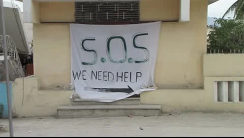 Destroyed homes and sign for help after earthquake in Haiti Video stock 8950883