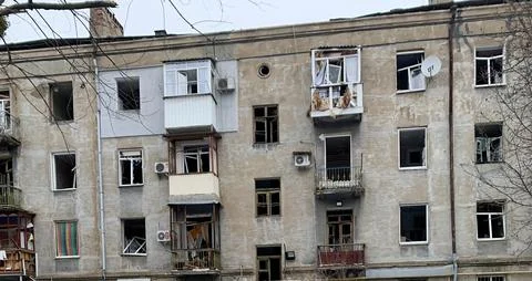A destroyed house after a rocket attack is depicted. Stock Photos