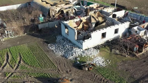 Destroyed houses after bomb attacks in Ukraine. Burned tank. Ukraine war. Velyka Stock-Footage 244332803
