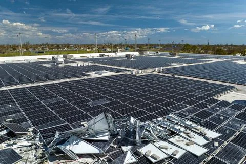 Destroyed by hurricane winds broken down photovoltaic solar panels mounted .. Stock Photos