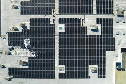 Destroyed by hurricane winds broken down photovoltaic solar panels mounted on Stock Photos