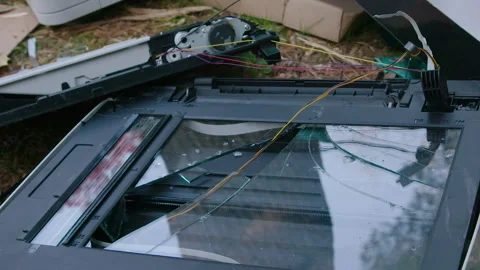Destroyed Old Printer &amp; Scanner with broken glass in trash dump / heap Video stock 153564091