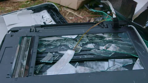 Destroyed Old Printer &amp; Scanner with broken glass in trash dump / heap Video stock 153564451