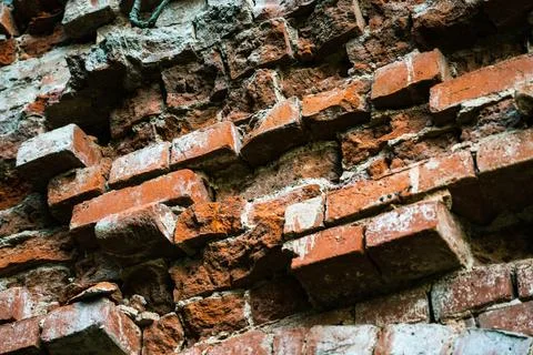 The destroyed old red brick wall, built in the 19th century Stock Photos