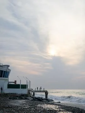 Destroyed pier under the waves. Bad weather at sea. Beautiful seashore with.. Stock Photos
