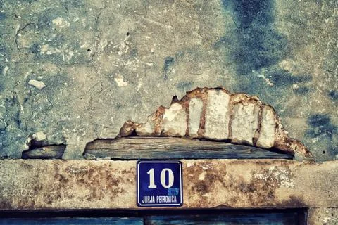 Destroyed plaster wall or cement brick wall texture Stock Photos