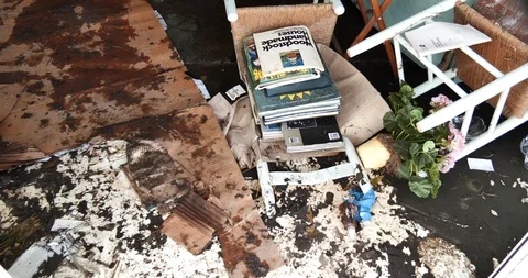 Destroyed pool table revealed after tilt up from floor debris from storm surge Stock Footage 98912027