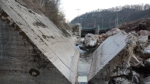 Destroyed riverbed by small hydro power plant. Huge dam on the river. Ecology Video stock 114818893