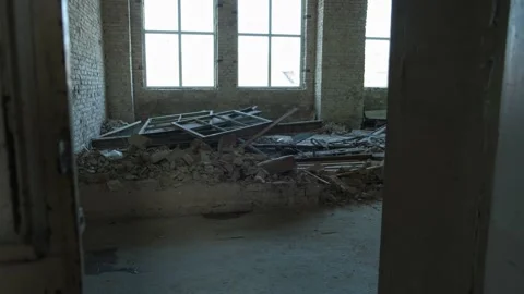 Destroyed room with rubble and broken windows. Symbol of renovation or collapse Video stock 310941783