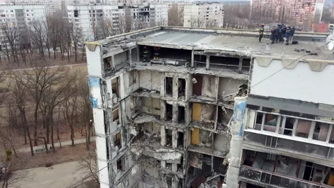 Destroyed by Russian artillery multi-storey residential building in the Stock Footage 231571779
