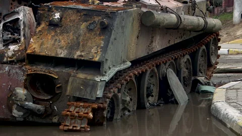 Destroyed russian tank in a puddle in Bucha Stock Footage 218377205