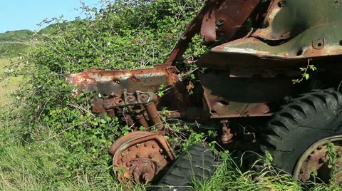 Destroyed rusty military vehicle overgrown brambles 4 Stock Footage 40708853