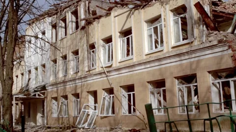 A destroyed school building after shelling in Ukraine Stock Footage 266222168