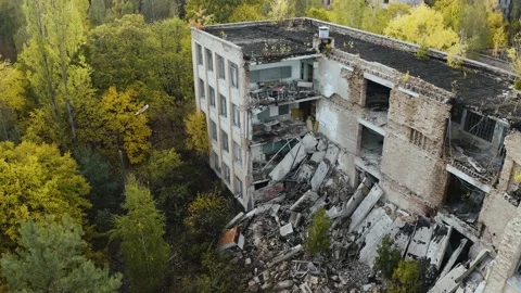 Destroyed School Building of Pripyat. Drone flyover the abandoned city of Stock Footage 153365444