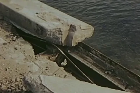 Destroyed section of retaining wall of bridge passes over Motoyasu River - 1946 Stock Footage 103372324