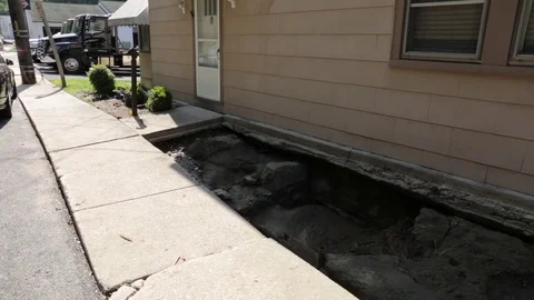 Destroyed sidewalk after flood damage and disaster in Ellicott City, Maryland. Stock Footage 70537621