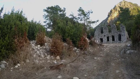 Destroyed by time the buildings of the ancient city in a mountain forest, Stock Footage 81746635
