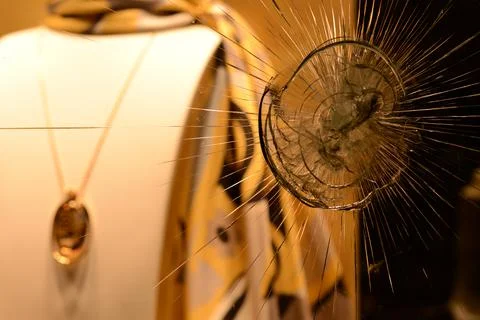 Destroyed window after an attack on the store with blurred background Foto stock