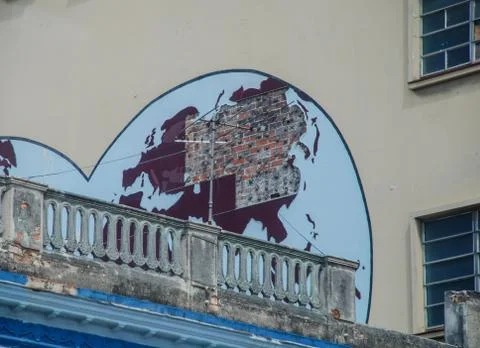 Destroyed world map on the wall of a house in Havana Stock Photos