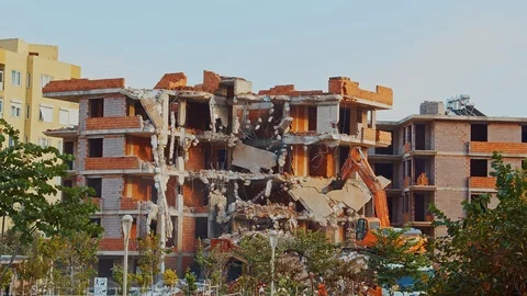 Destroying Concrete House Using Mechanical Arm Stock-Footage 120610235