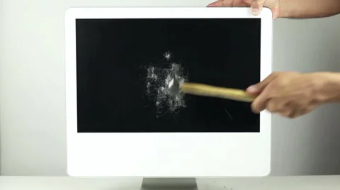Destroying a desktop computer with a hammer Stock-Footage 42652592