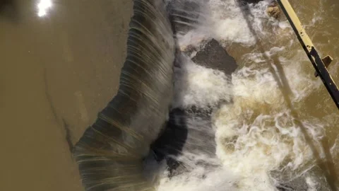 Destructed town road during the flood. Submerged and cracked asphalt landslid Stock Footage 165282702