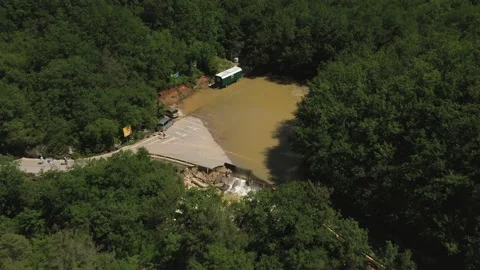 Destructed town road during the flood. Submerged and cracked asphalt landslid Stock Footage 165282825