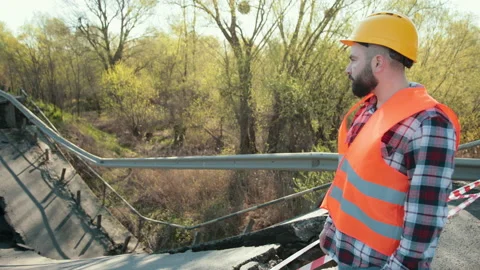Destruction of canvas, collapse of bridge structure. Engineer in hardhat audit Stock Footage 153720882