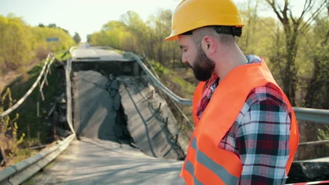Destruction of canvas, collapse of bridge structure. Engineer in hardhat audit Stock Footage 154227229