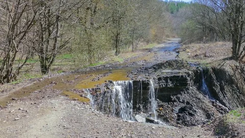 Destruction of road in forest in springtime Stock Footage 73939828