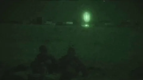Destruction of the Target from the Minigun aboard the Helicopter, amid soldiers  Video stock 120843669