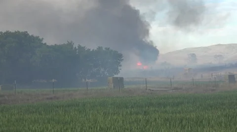 Destructive rural drought induced fire Farm buildings 4K Video stock 51684624