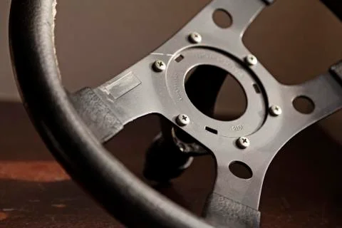 Detachable black steering wheel for a racing car of any kind Stock Photos