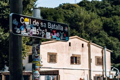 Detached house, forest in the background and the sign of Coll de sa Batalla in M Stock Photos