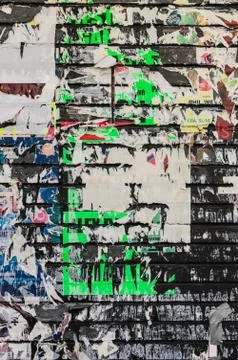 Detached poster on a painted wall Stock Photos