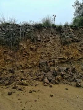 Detachment of rocks in a wall Foto stock