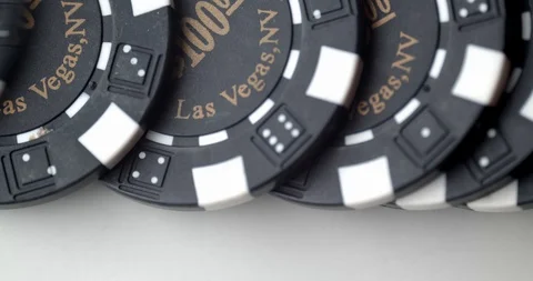 Detail of  $100 chips dashed across table Stock Footage 112332054