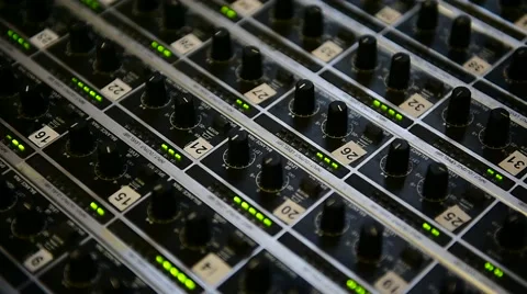 Detail with adjusting knobs on a professional audio mixer Видео 67731425