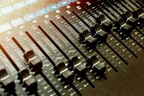 Detail with adjusting knobs on a professional audio mixer and music equipment Foto stock